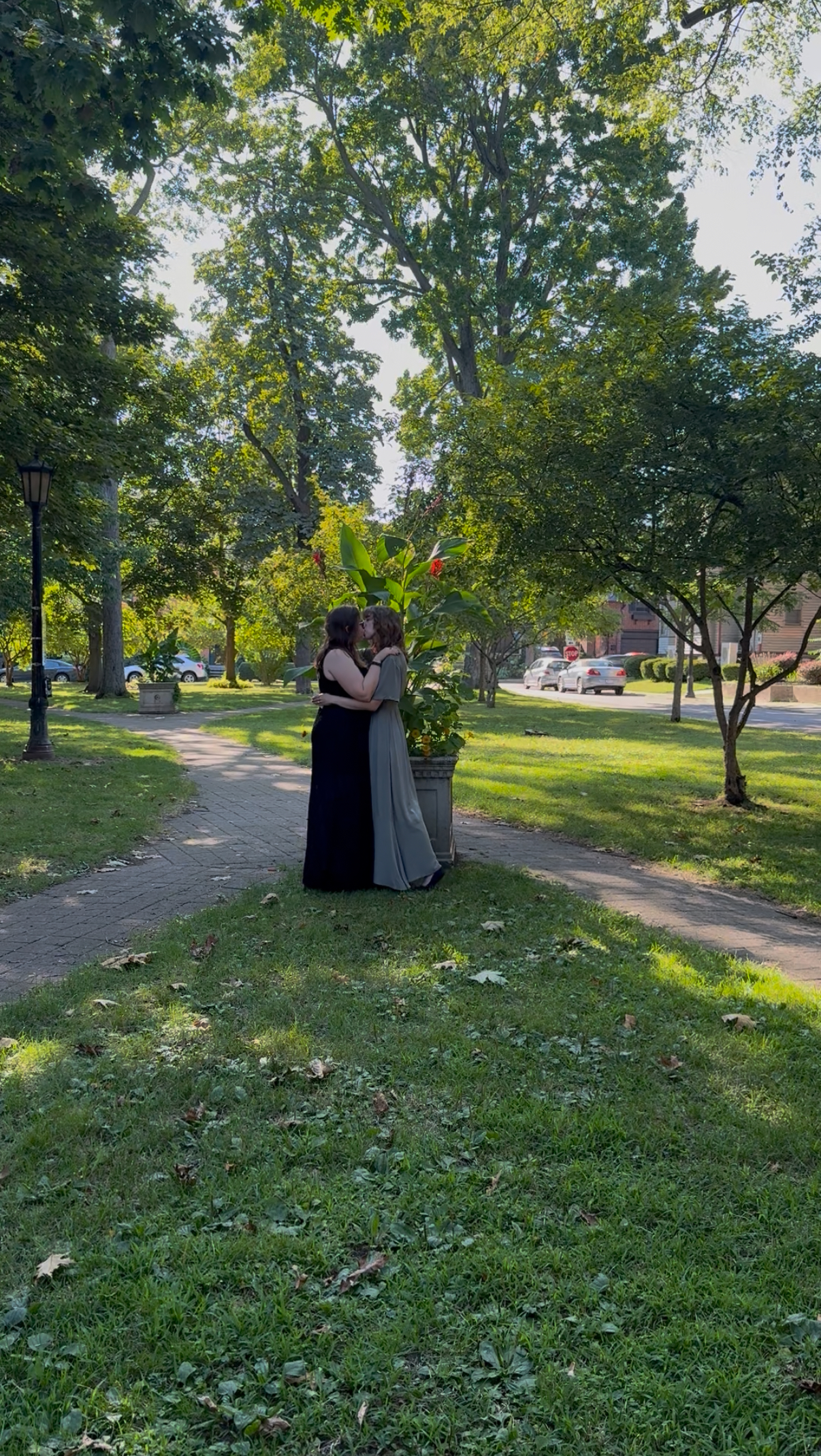 Taylor and Emily embracing in the park